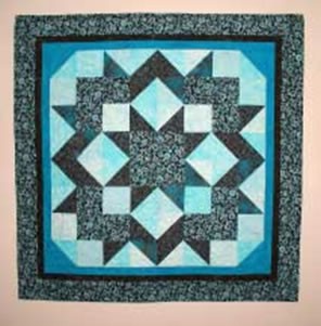 Gallery of beautiful quilts using the Hang it Dang it Quilt Hanger