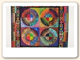 Here is a picture of my quilt "Fireworks" on the Hang it Dang it. The wall hanging is 51" x 51".  I love the way it hangs and the Hang it Dang it was so easy to use. I will be ordering more of them.  Your company was very prompt in sending it and it was in excellent condition.
- Pat, Tennessee